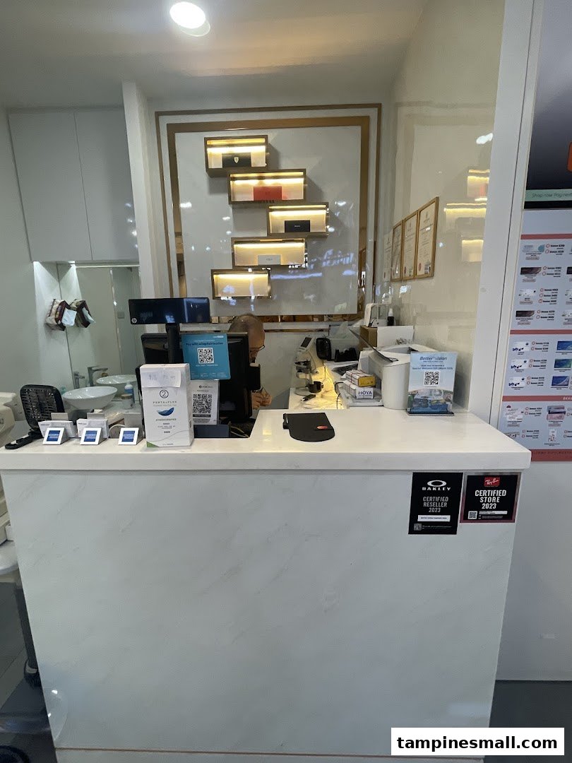 An interior shot of Better Vision's modern counter area with product displays and service desk.