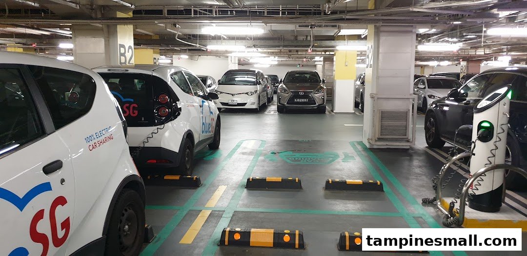BlueSG electric car sharing vehicles parked and charging in Tampines Mall's B2 parking deck.