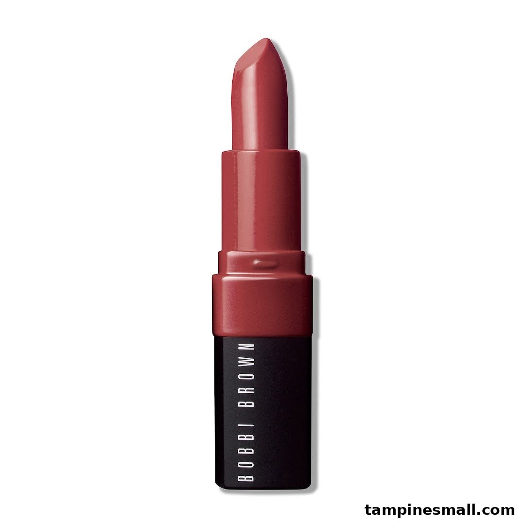 A close-up studio shot of a Bobbi Brown lipstick in a rich red shade.