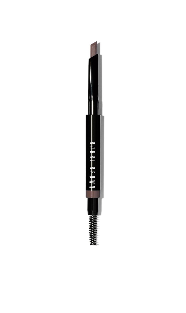 A Bobbi Brown eyebrow pencil with a spoolie brush on a white background.