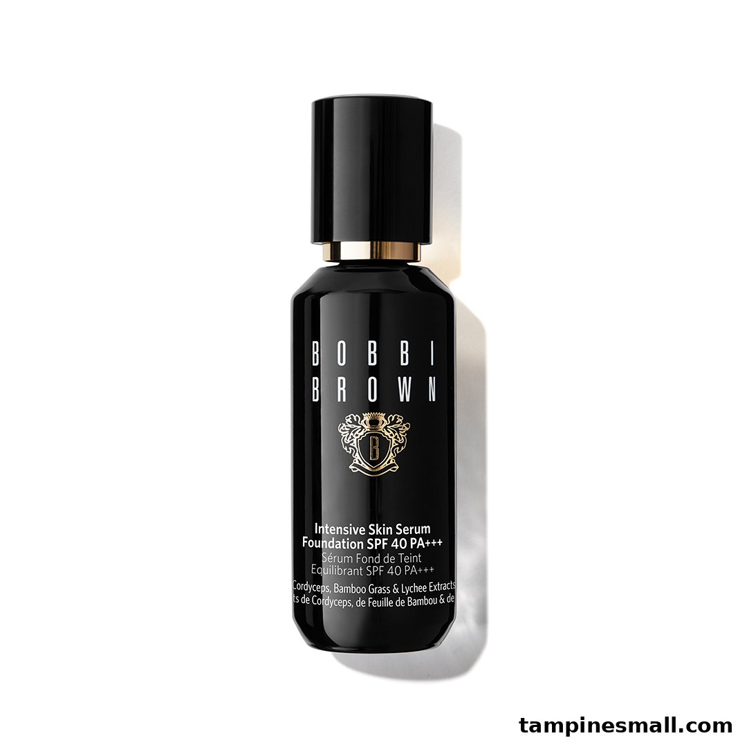 A black Bobbi Brown Intensive Skin Serum Foundation bottle with gold accents on a white background.