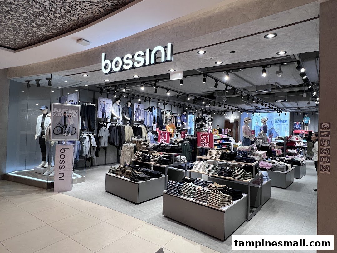 The image shows the inviting entrance and well-lit interior of the Bossini clothing store, featuring various apparel displays.