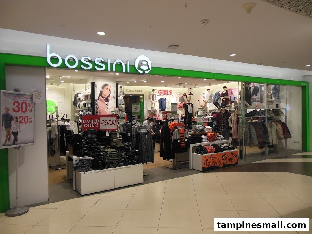 The brightly lit entrance of Bossini clothing store, showcasing apparel displays and promotional offers.
