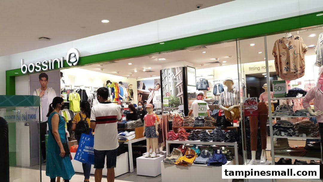 A vibrant interior view of Bossini clothing store, showcasing diverse apparel displays and shoppers browsing.