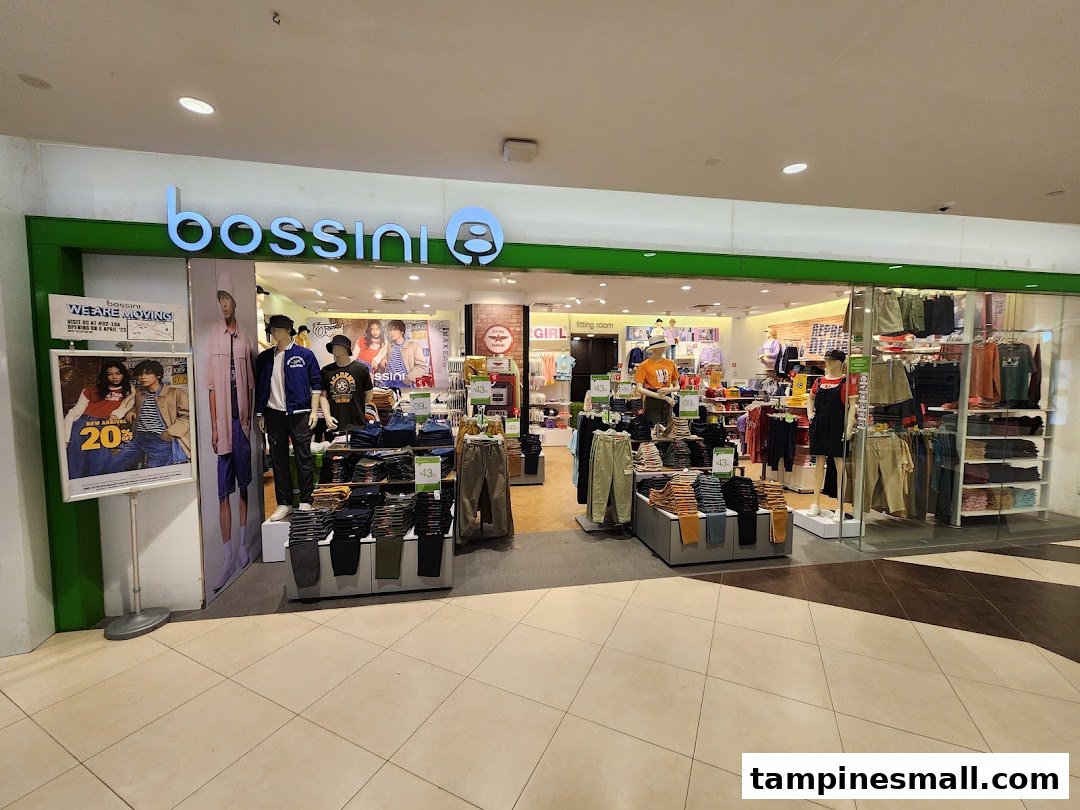 The brightly lit entrance of bossini, a fashion apparel store, showcasing mannequins and clothing displays.