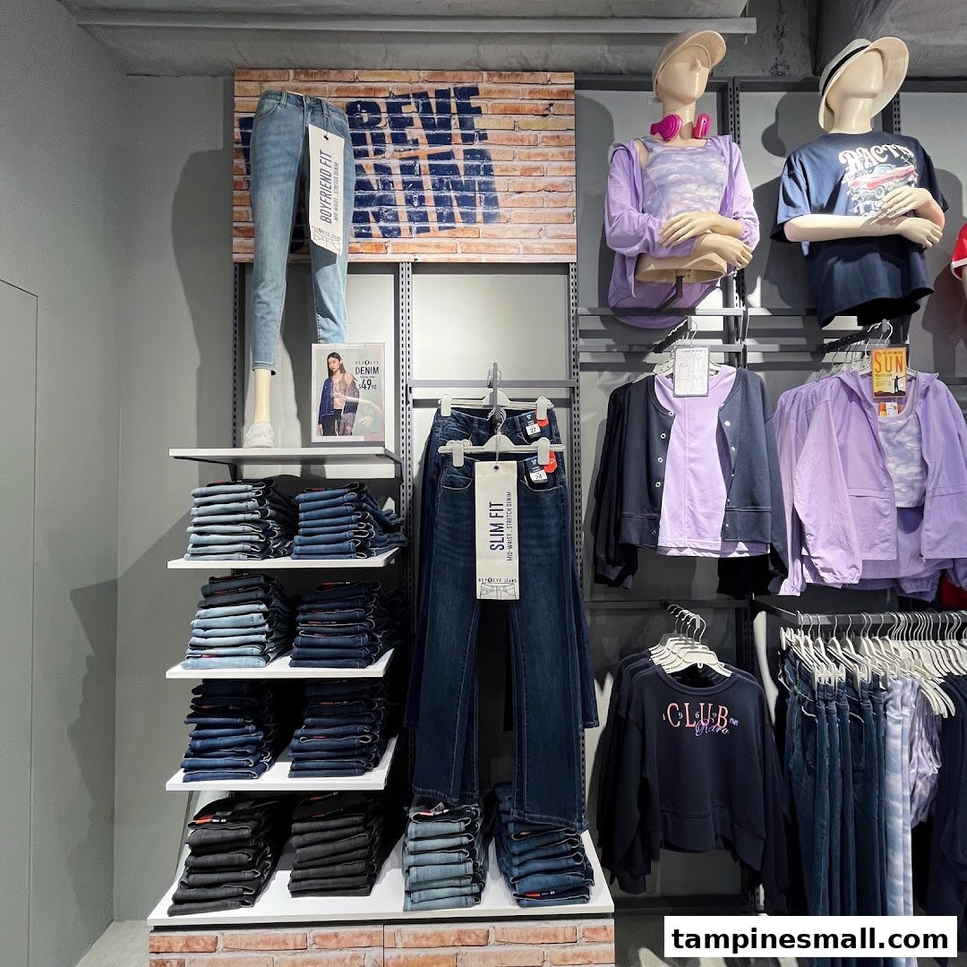 A vibrant display of Bossini's denim collection and casual wear, featuring various fits and styles.