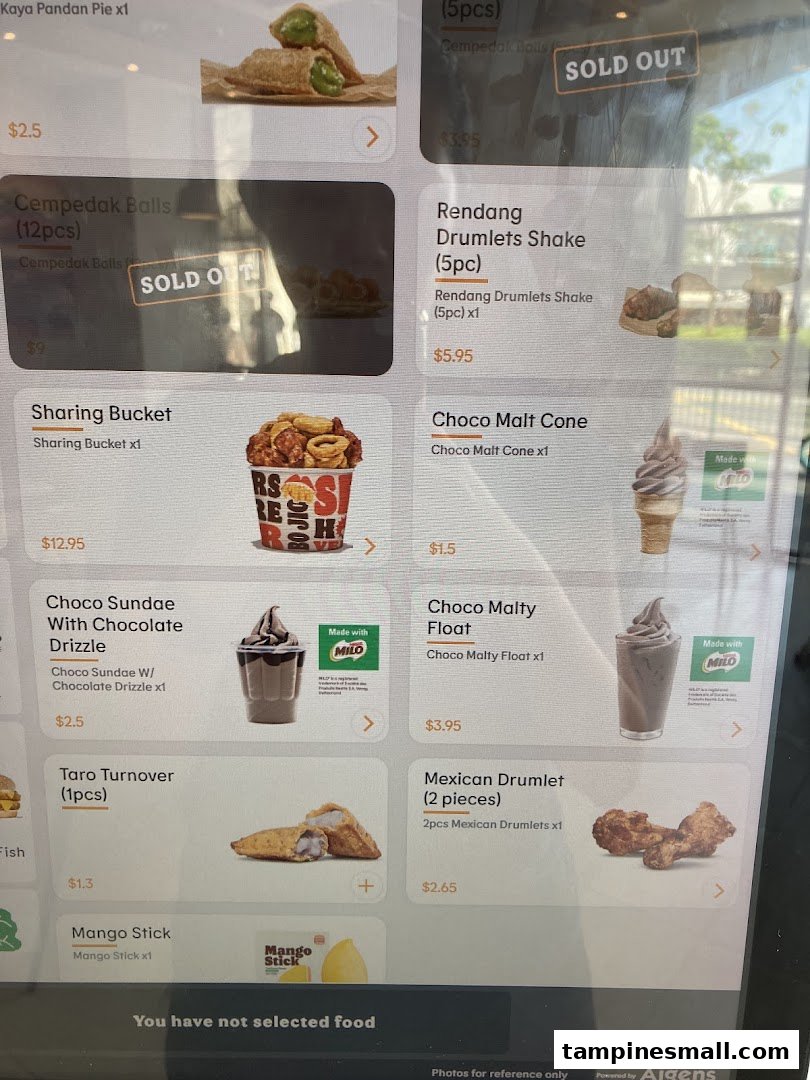 A digital menu board displaying various food and dessert items with prices, including some 'SOLD OUT' options.