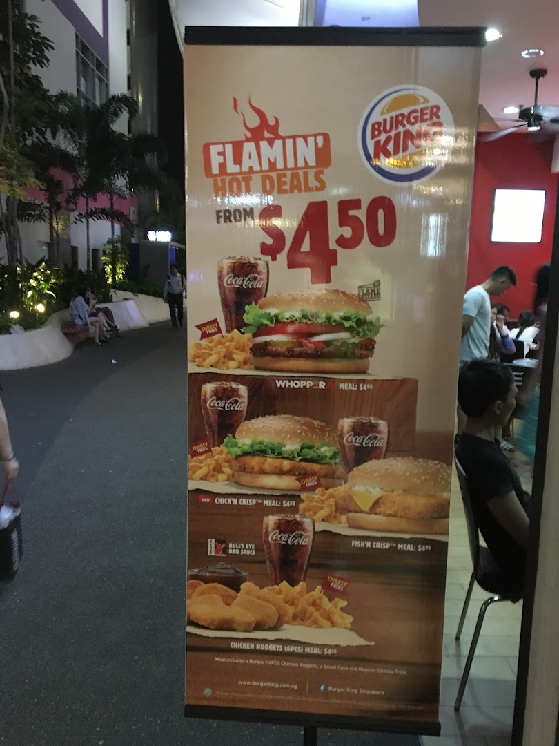 A Burger King promotional banner showcasing 'Flamin' Hot Deals' with various meal options and prices.