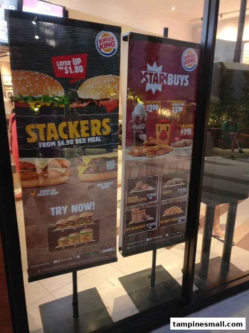 Promotional banners at Burger King Tampines Mall showcasing Stackers and Star Buys menu items.