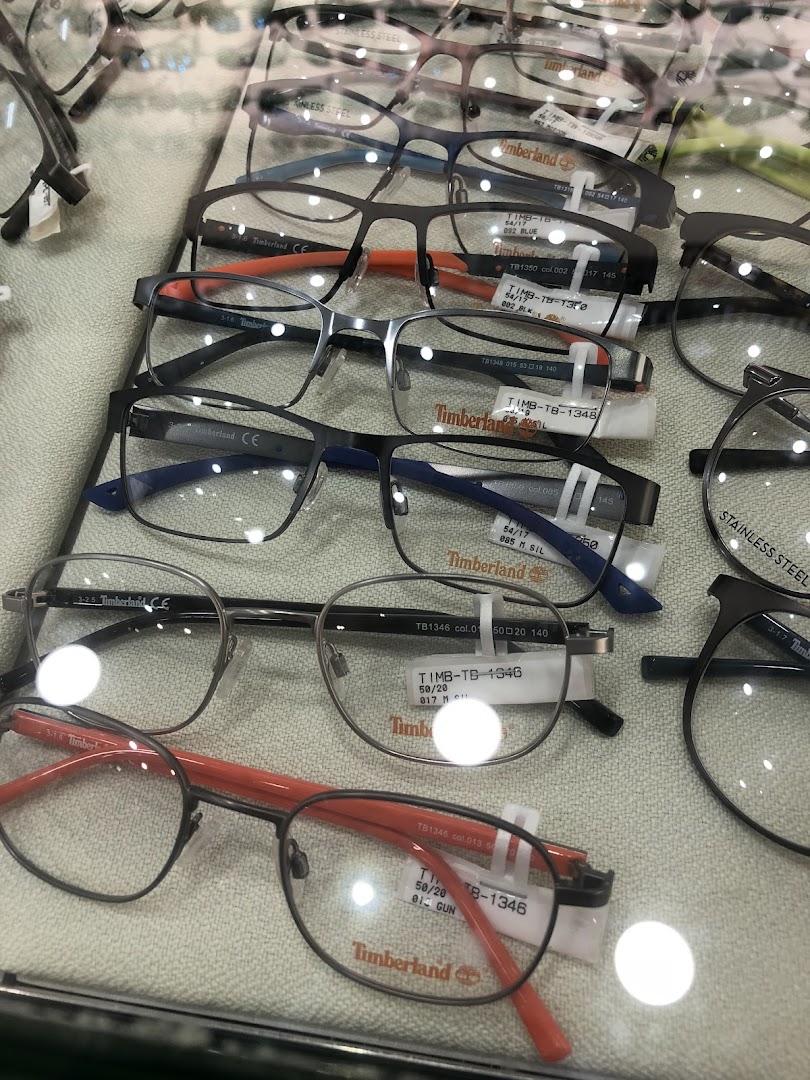 A close-up view of various Timberland brand eyeglasses displayed in a retail case.