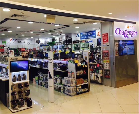 The entrance of mini Challenger electronics store, showcasing a wide array of tech products and accessories.