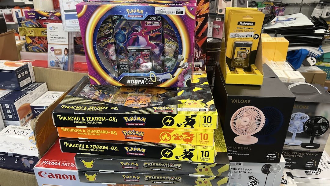 A retail display featuring Pokémon TCG sets, portable fans, and various tech accessories at Challenger.