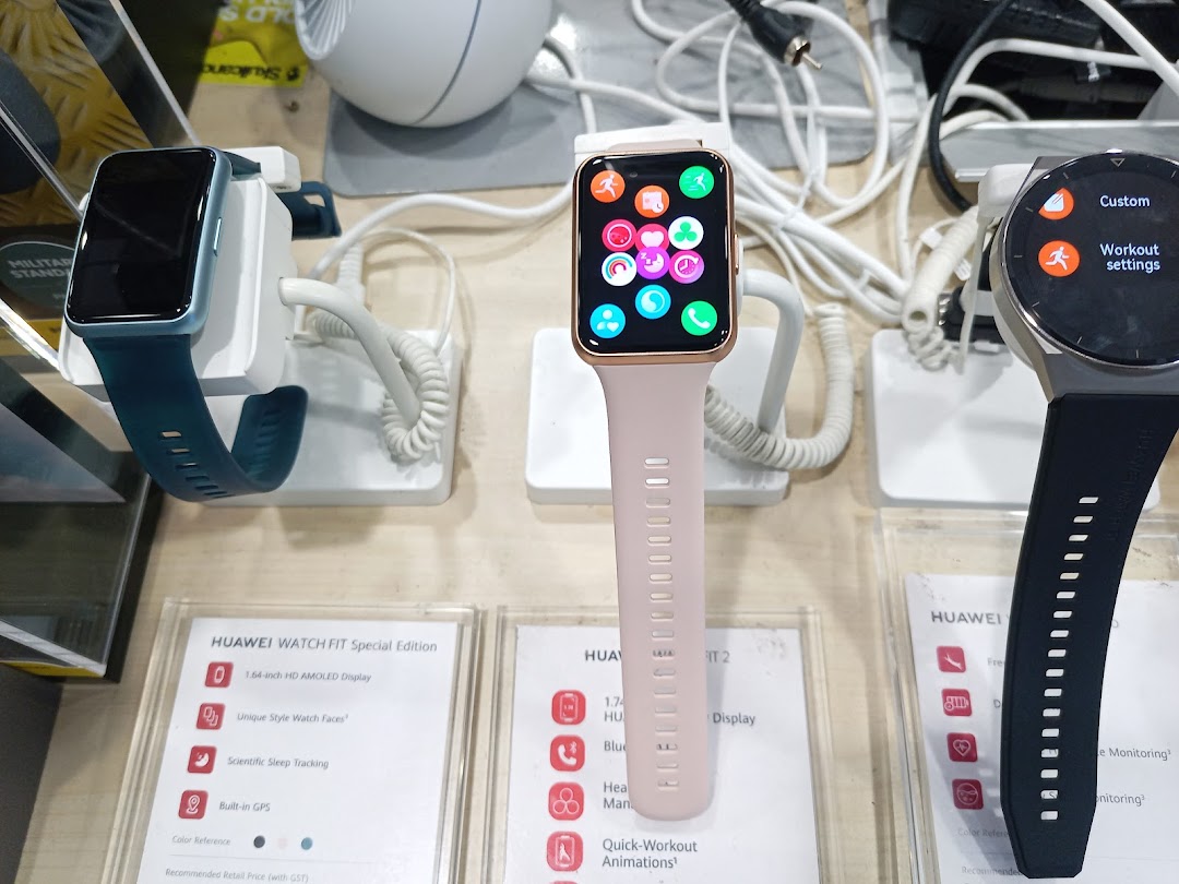 Close-up of smartwatches on display with feature descriptions at Challenger.