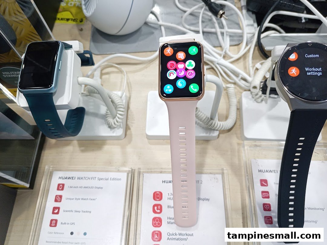 Close-up of smartwatches on display with feature descriptions at Challenger.