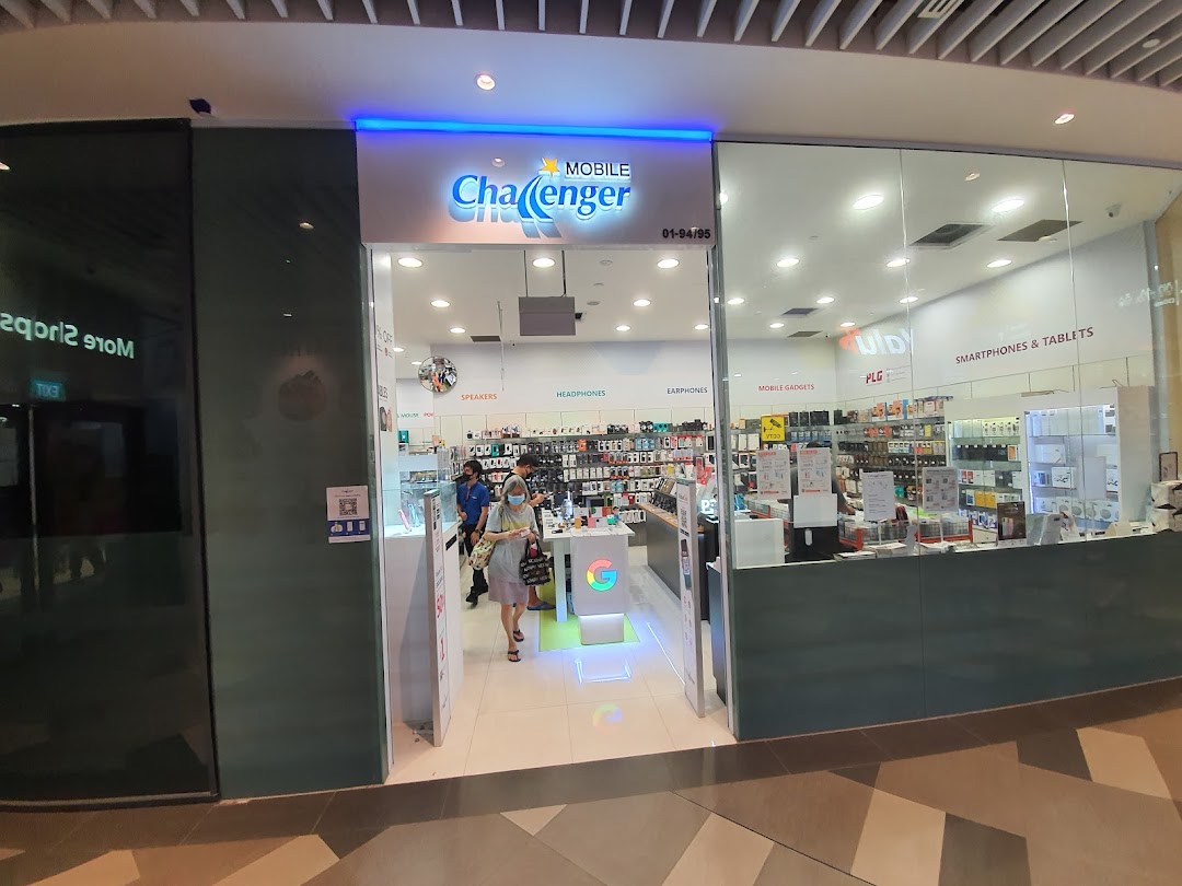 The brightly lit entrance of Challenger Tampines Mall, an electronics and mobile accessories store.