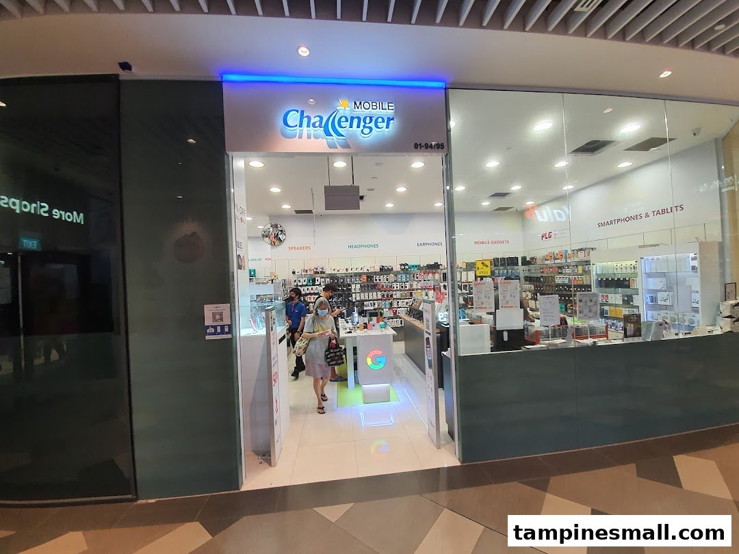 The brightly lit entrance of Challenger Tampines Mall, an electronics and mobile accessories store.