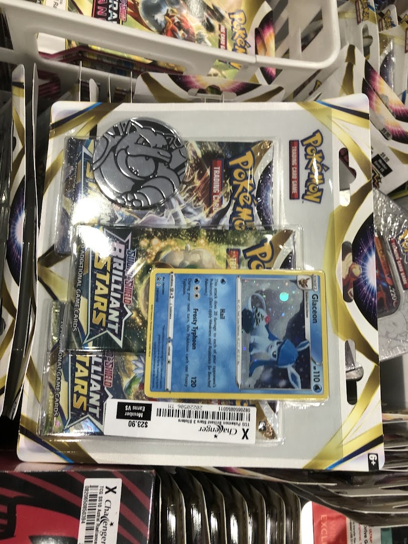 A close-up of a packaged Pokémon Trading Card Game set featuring a Glaceon card and price tag.