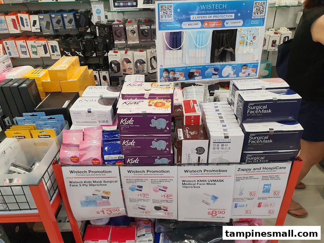 A retail display featuring various face masks, tech accessories, and health products inside Challenger.
