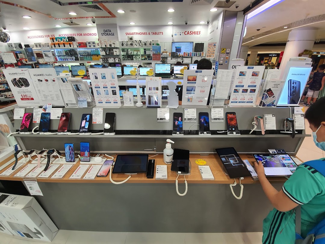 Interior view of Challenger electronics store showcasing smartphones, tablets, and accessories on display.