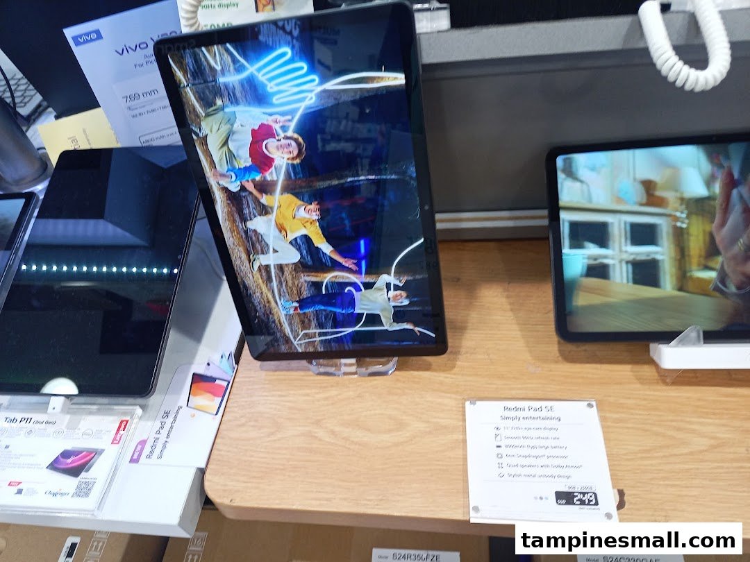 Tablets on display at Challenger, showcasing various models and features.