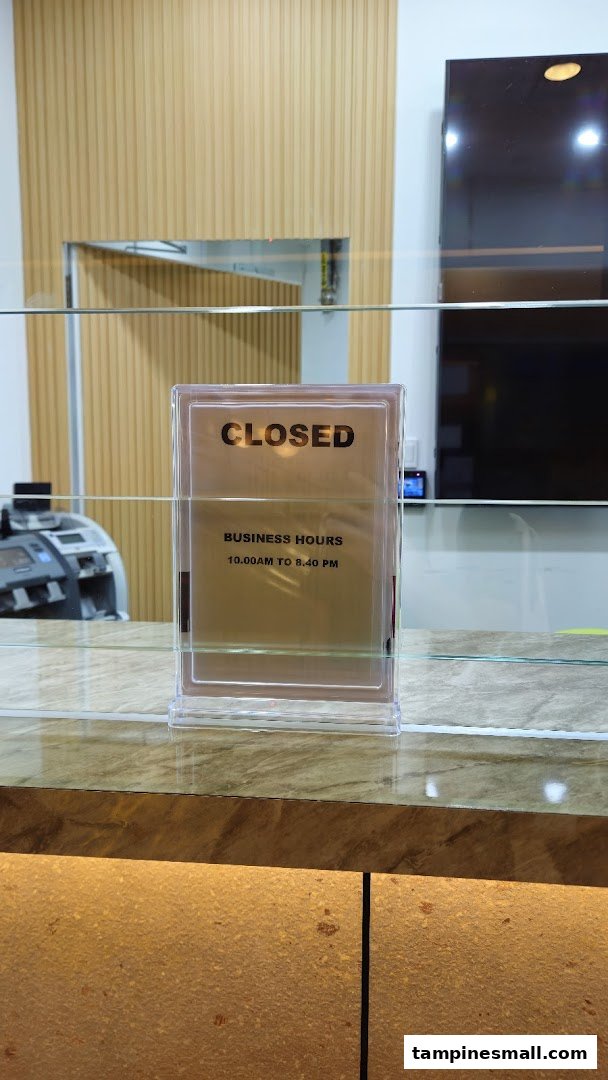A 'CLOSED' sign with business hours (10:00 AM to 8:40 PM) displayed on a counter.