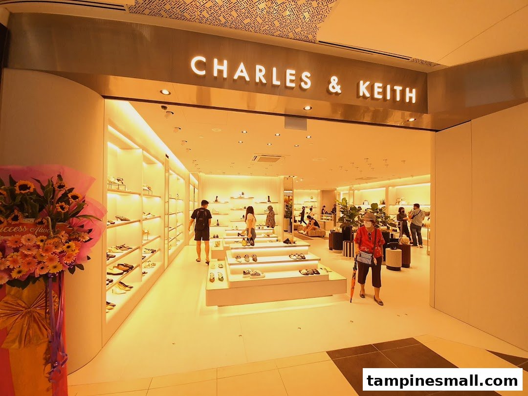 The CHARLES & KEITH shop entrance features a brightly lit interior showcasing shoes and accessories, with customers browsing.