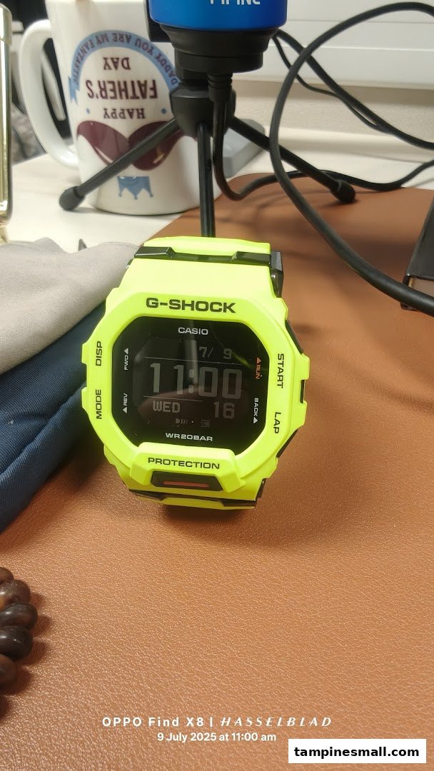 A vibrant neon green G-Shock watch displayed on a brown textured surface.