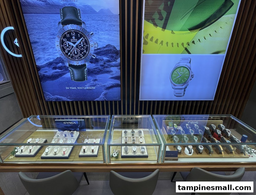 Interior view of City Chain showcasing luxury watches in display cases with large promotional posters.