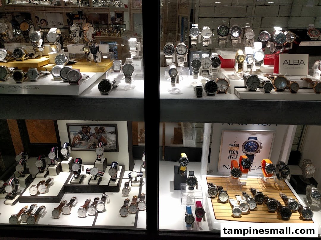 A brightly lit display of various watches from different brands inside City Chain.