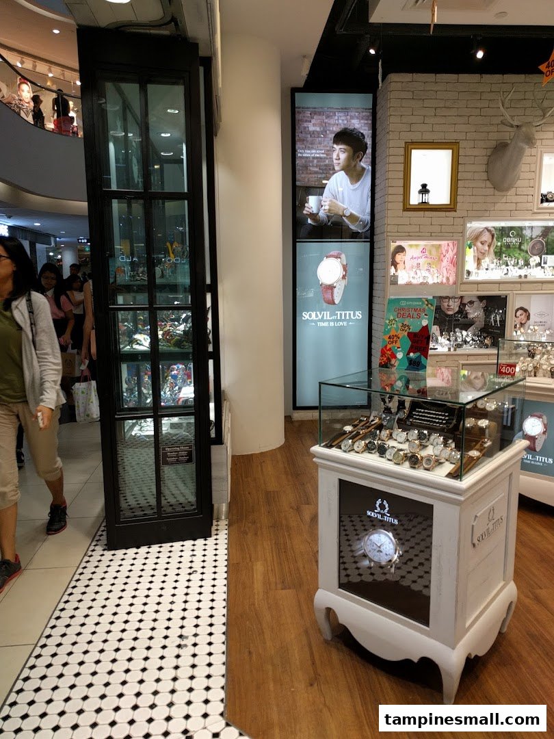Interior view of City Chain showcasing watch displays, digital screens, and decorative elements.