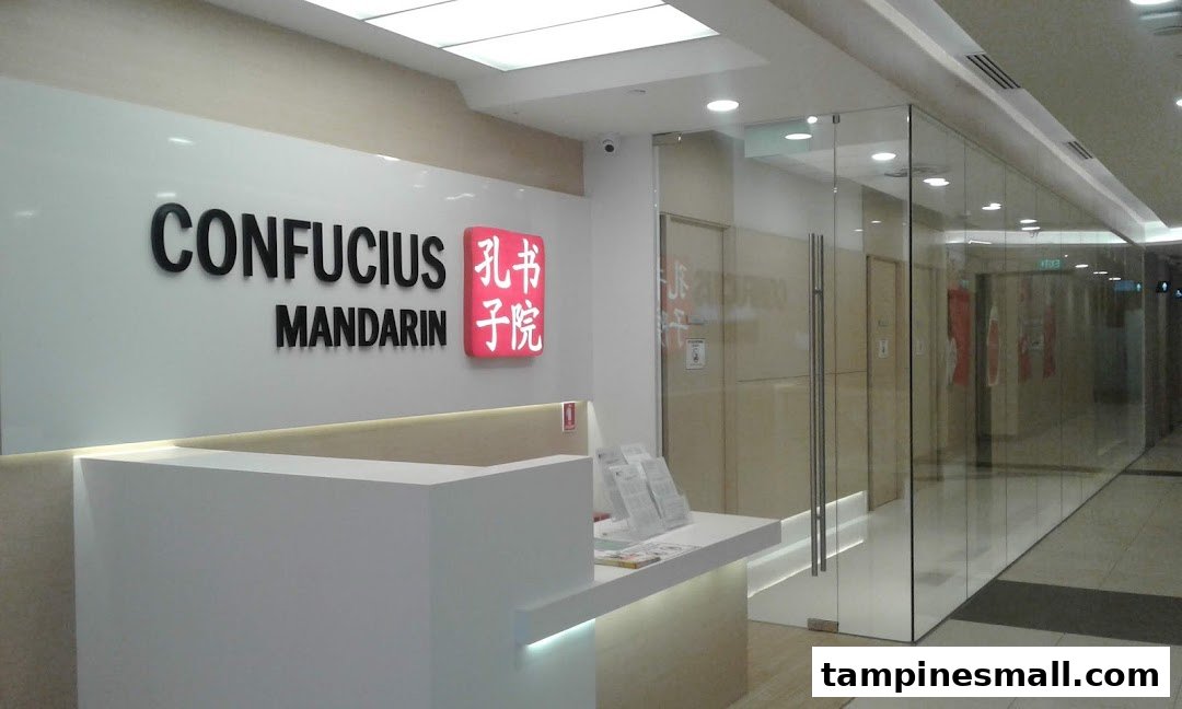 The modern reception area and glass entrance of Confucius Mandarin, a language learning center.