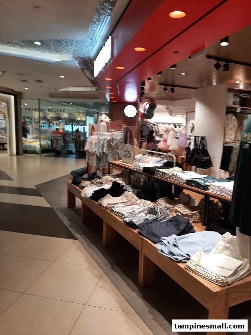 Interior view of Cotton On Tampines, showcasing a wide array of casual clothing and accessories on display.