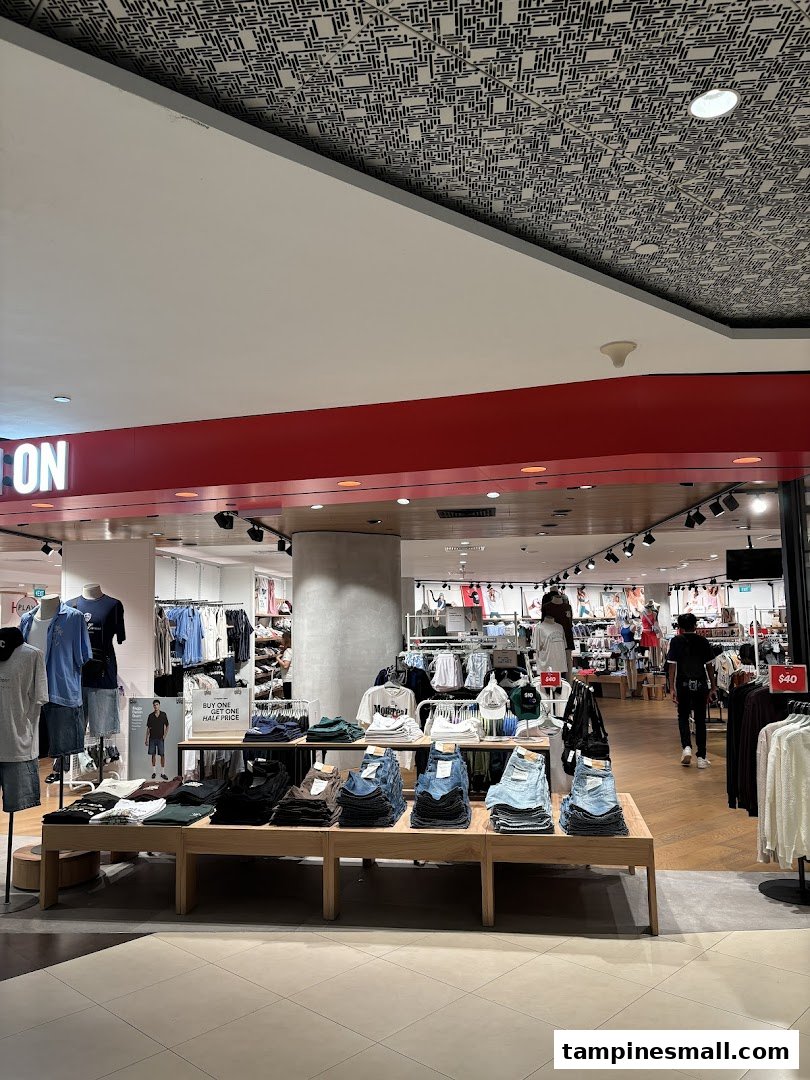 The entrance of Cotton On Tampines, showcasing trendy apparel and accessories on display.