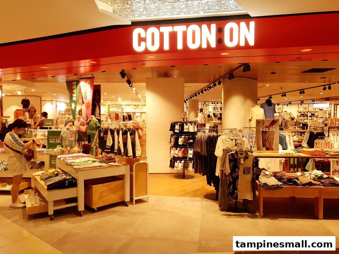 The vibrant entrance of Cotton On Tampines, showcasing trendy apparel and a welcoming shopping environment.