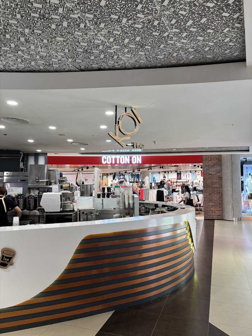 The entrance of Cotton On Tampines, with a KOI The bubble tea counter in the foreground.