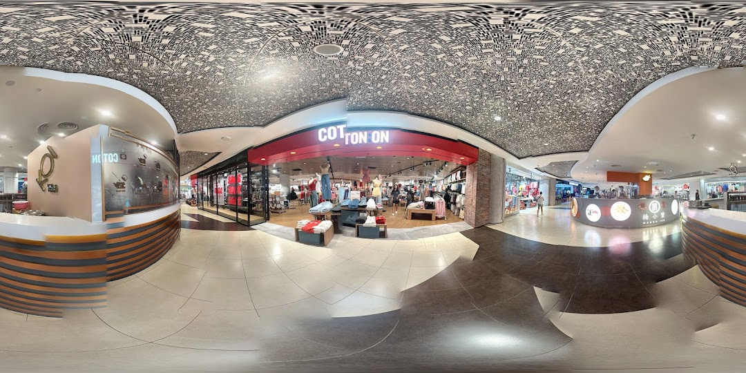 The vibrant red entrance of Cotton On, showcasing its trendy apparel and accessories.