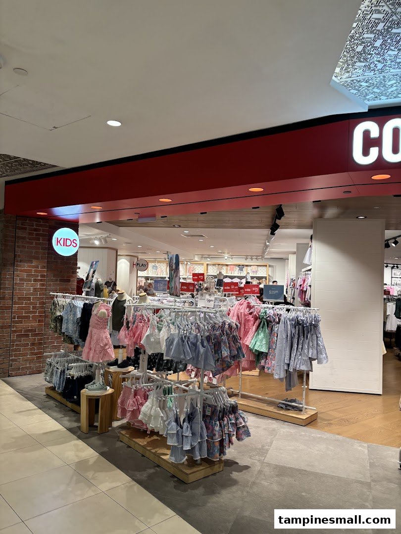 The vibrant entrance of Cotton On Tampines showcasing a wide array of kids' apparel and accessories.