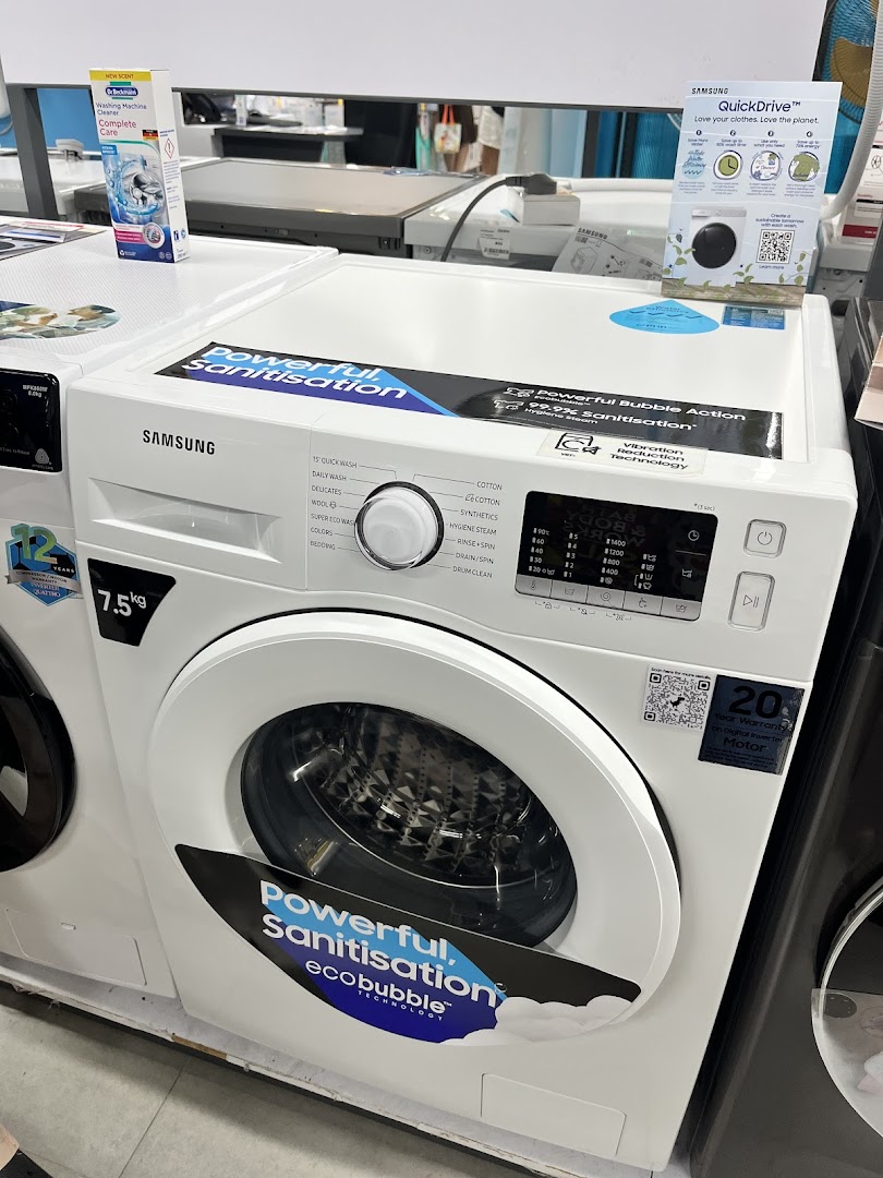 A white Samsung washing machine with 'Powerful Sanitisation' and 'ecobubble' features on display.