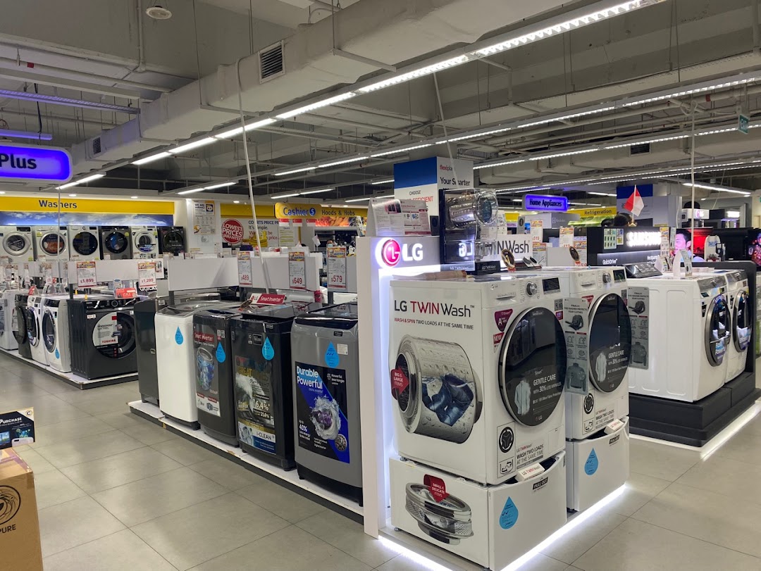 Interior view of COURTS Tampines Mall, showcasing a wide selection of washing machines and home appliances.