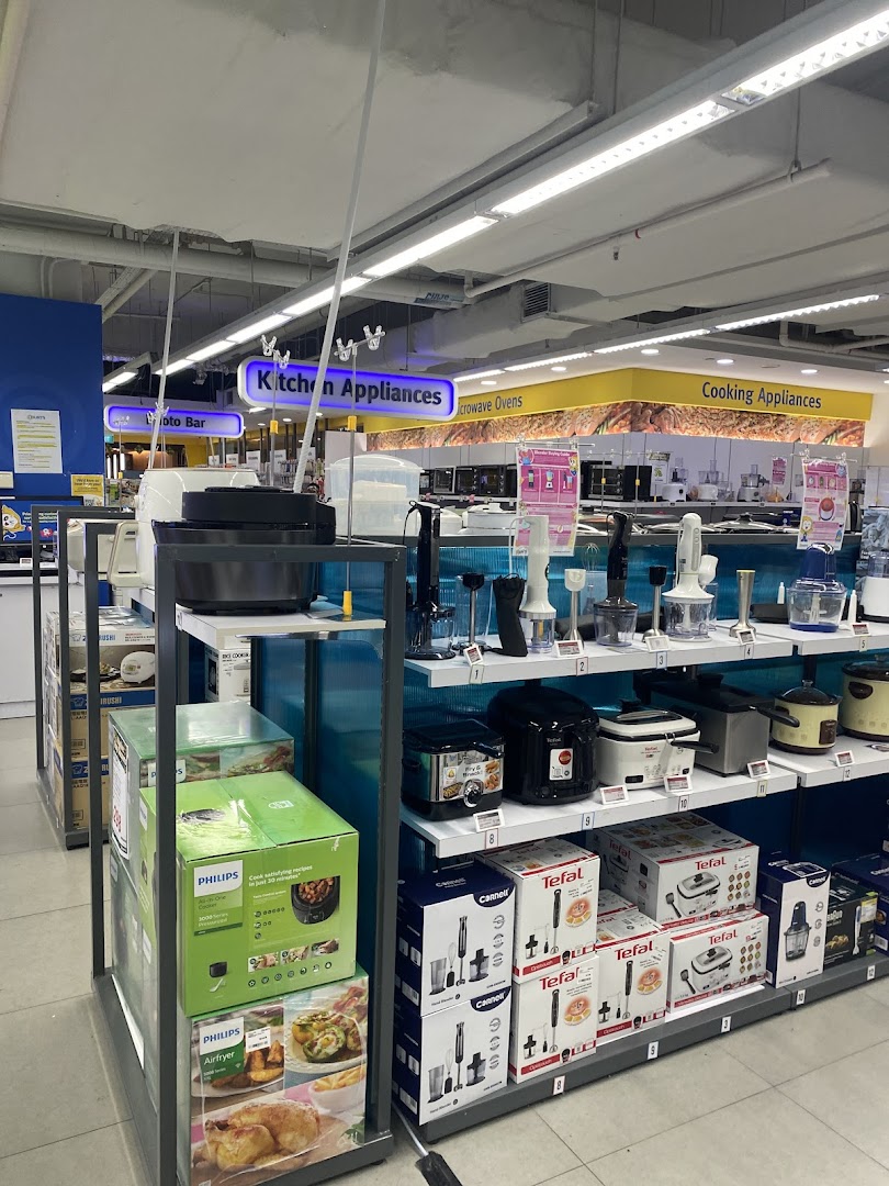 An aisle at COURTS Tampines Mall showcasing a wide range of kitchen and cooking appliances.