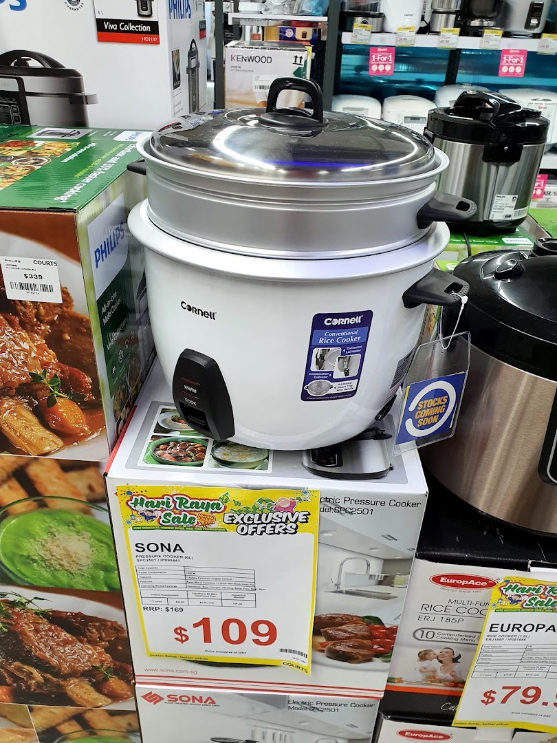 A display of kitchen appliances, including rice cookers and pressure cookers, at COURTS Tampines Mall.