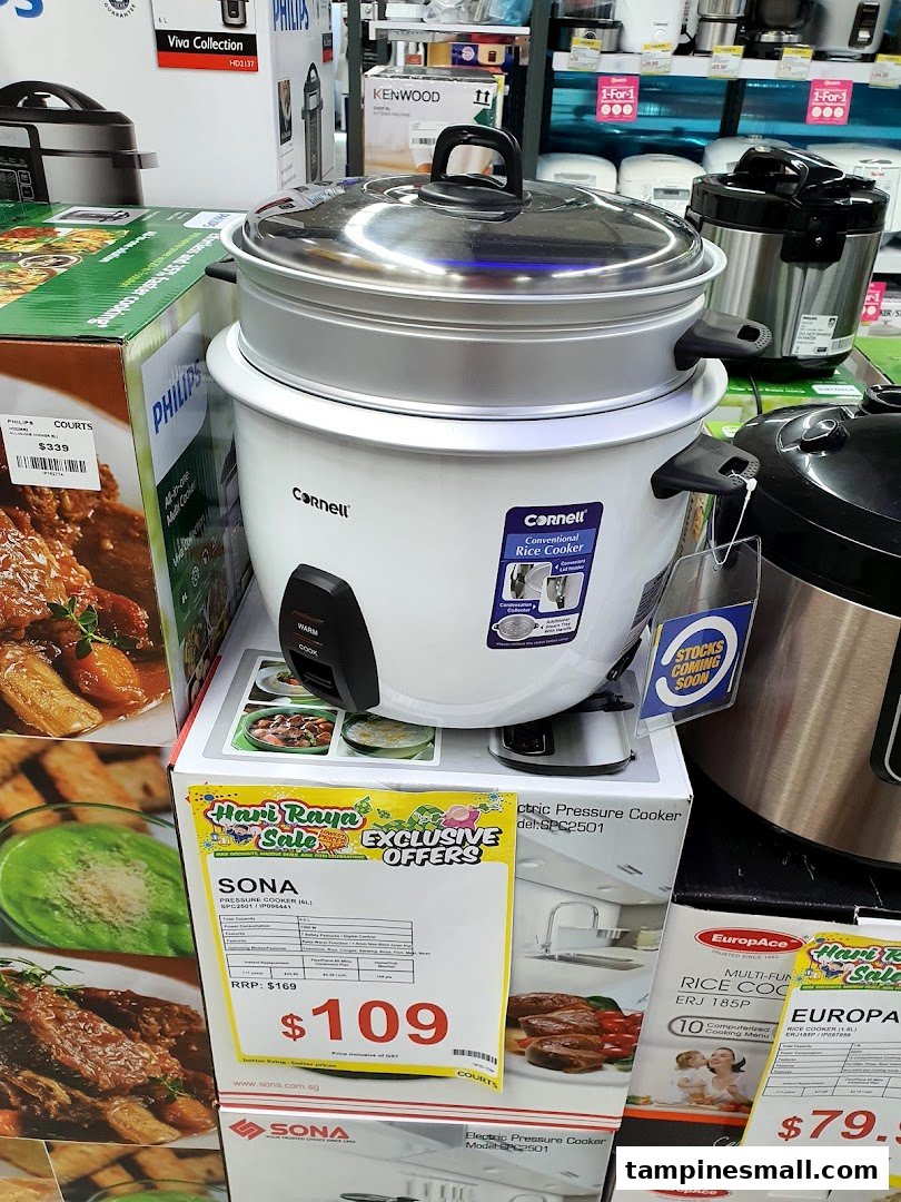 A display of kitchen appliances, including rice cookers and pressure cookers, at COURTS Tampines Mall.