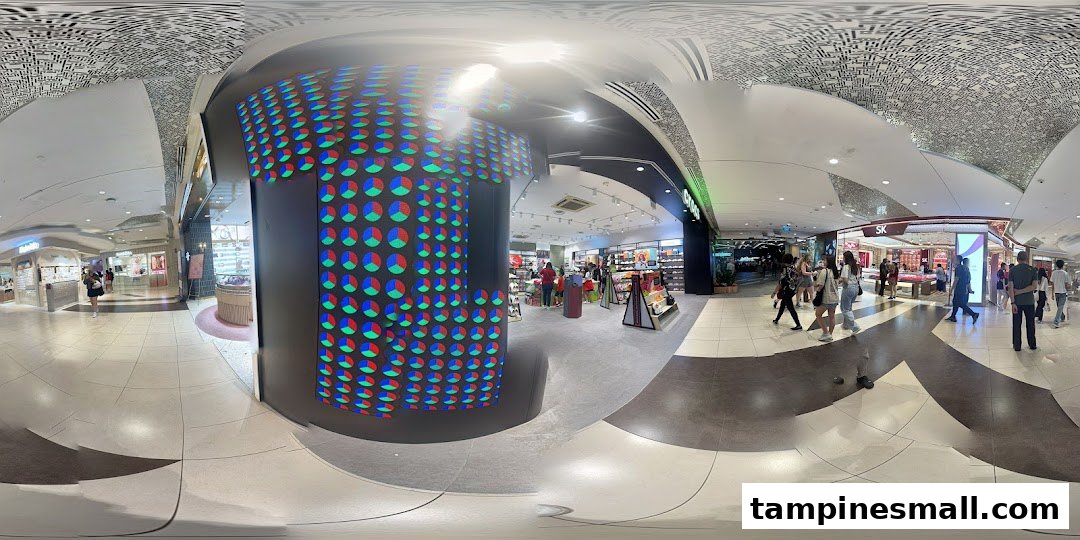 A panoramic view of a bustling shopping mall interior featuring the Crocs store and other retail outlets.
