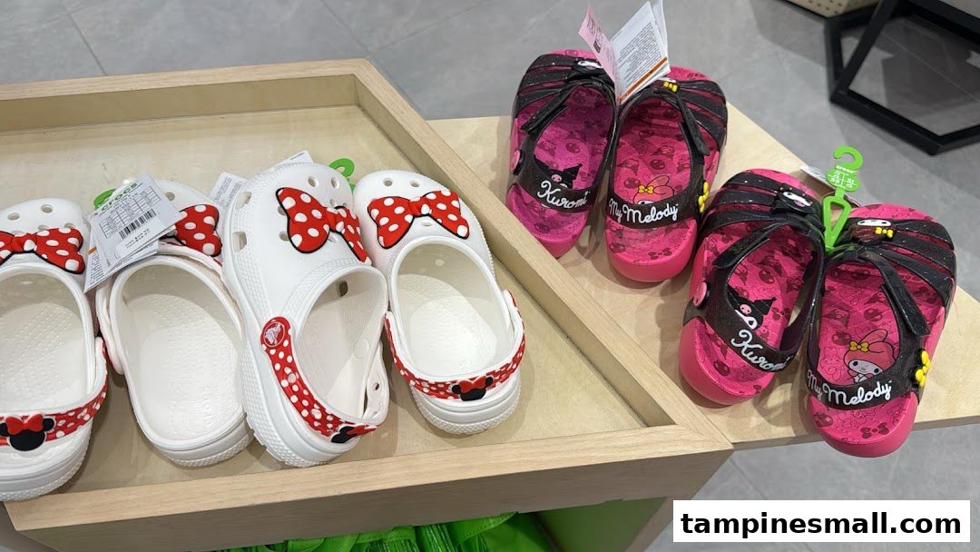 Close-up of Crocs shoes and sandals featuring popular character designs like Minnie Mouse, Kuromi, and My Melody.