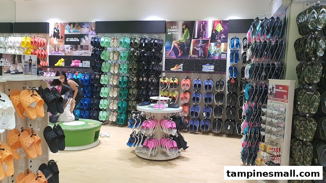 Interior view of a Crocs store showcasing a wide variety of colorful footwear and accessories.