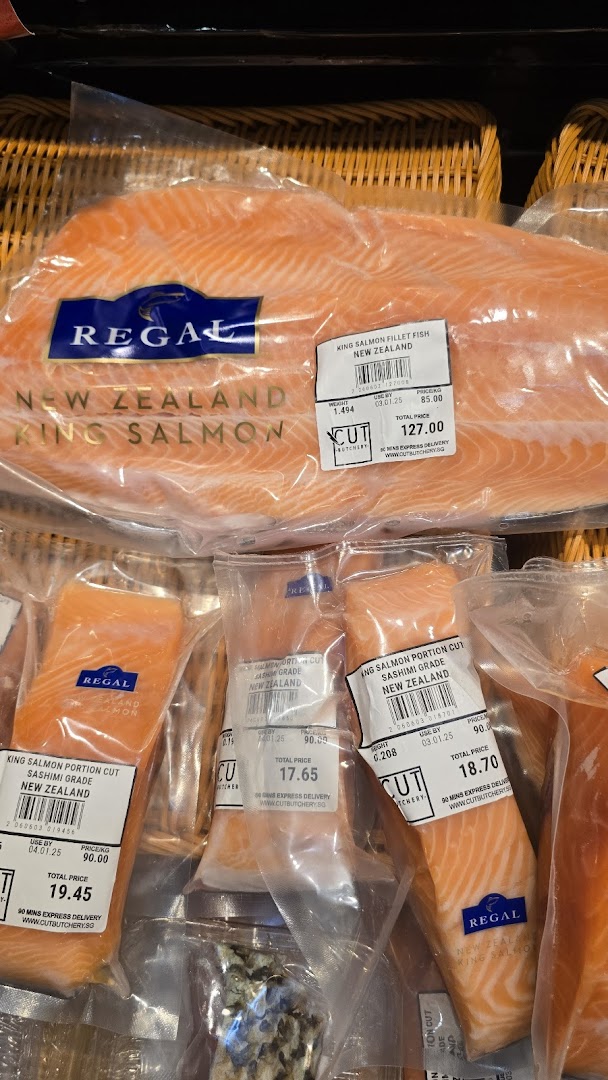 Close-up of various packaged New Zealand King Salmon products with price labels at Cut Butchery.