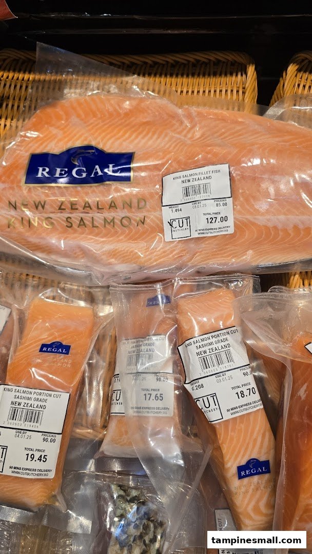 Close-up of various packaged New Zealand King Salmon products with price labels at Cut Butchery.