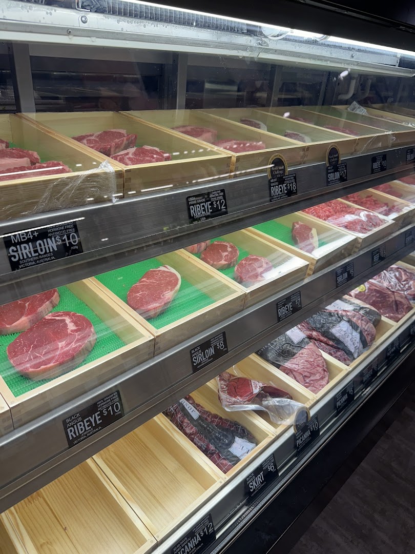 A refrigerated display case showcasing various premium cuts of fresh beef at Cut Butchery.