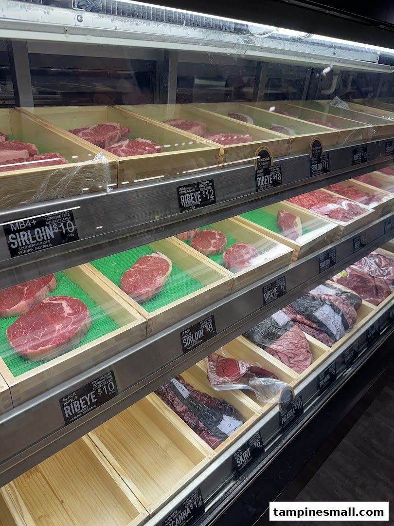 A refrigerated display case showcasing various premium cuts of fresh beef at Cut Butchery.
