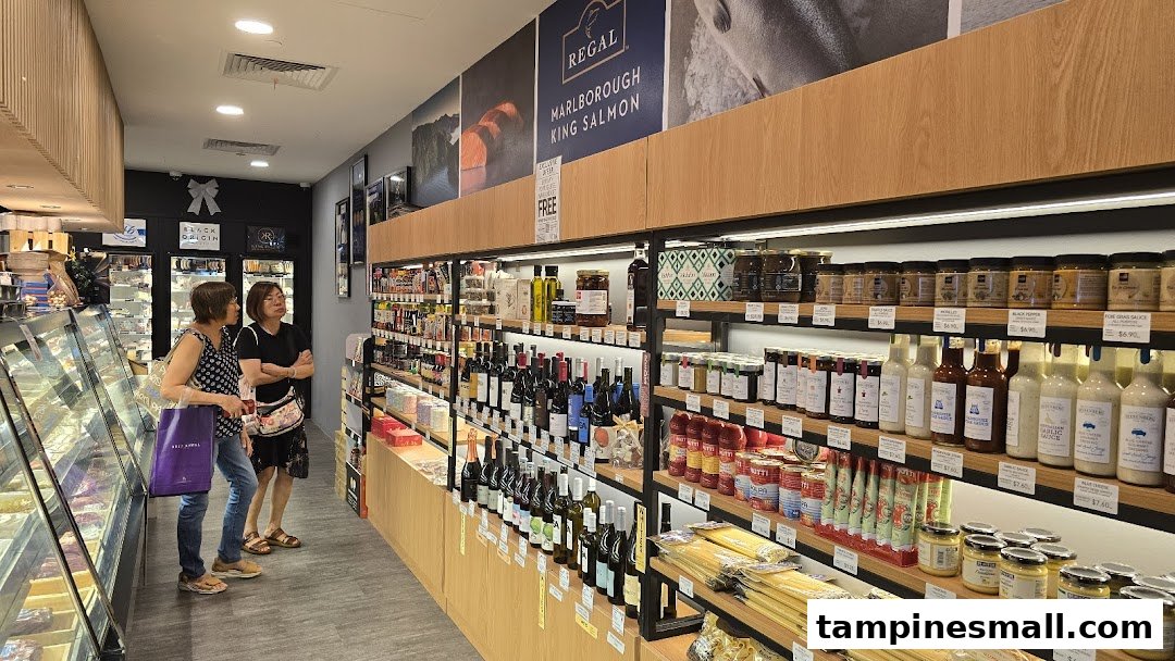 Customers browse a wide selection of gourmet foods, wines, and fresh produce inside Cut Butchery.